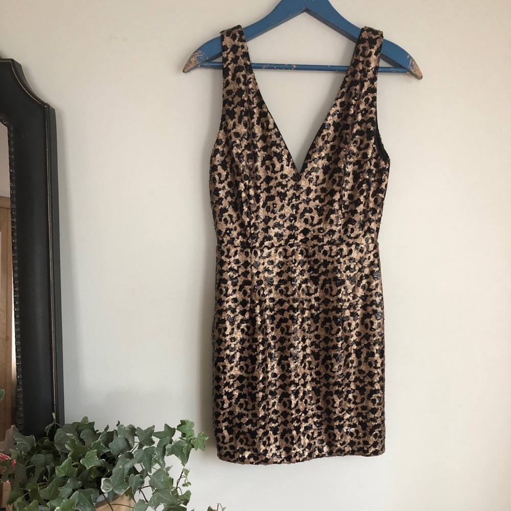 Sequined black and gold mini dress